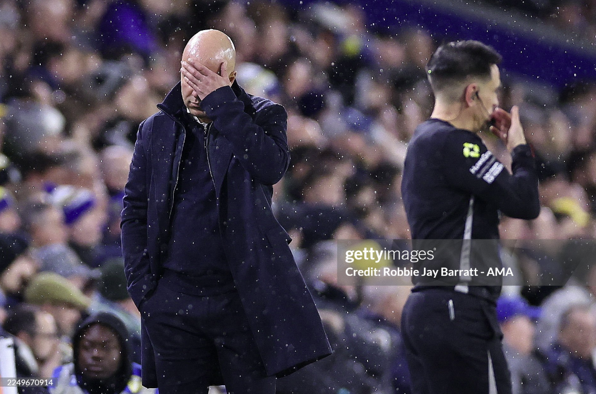 Arne Slot covering his face during Liverpool's 3-3 draw against Leeds.